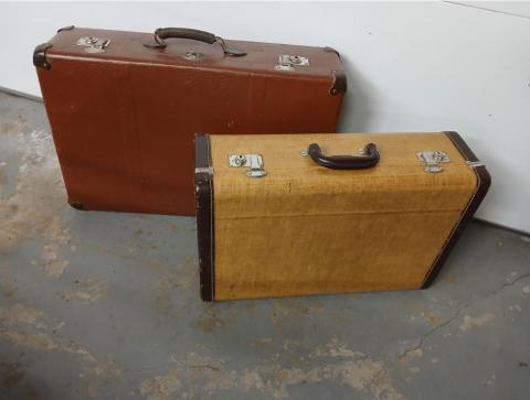 2 brown suitcases