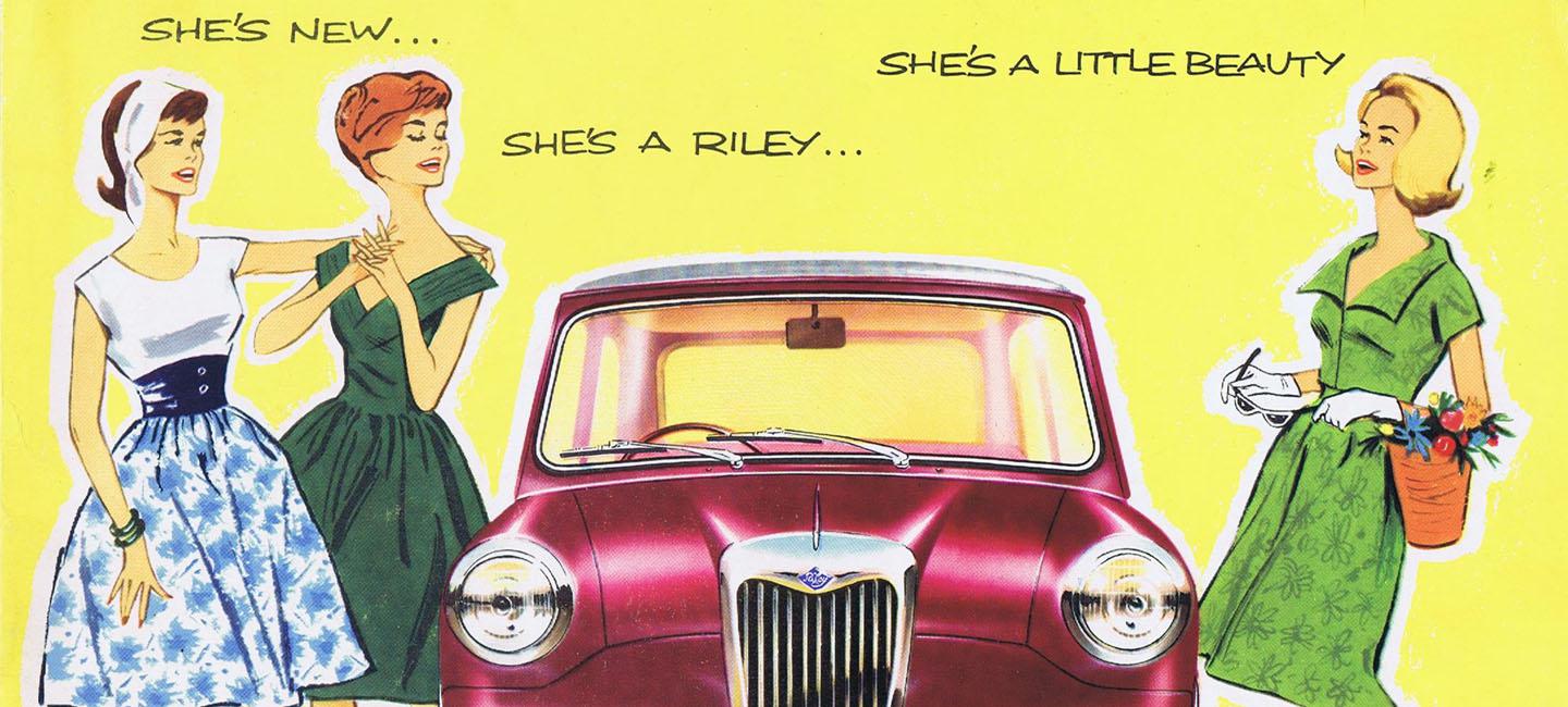 Three woman looking at a red car